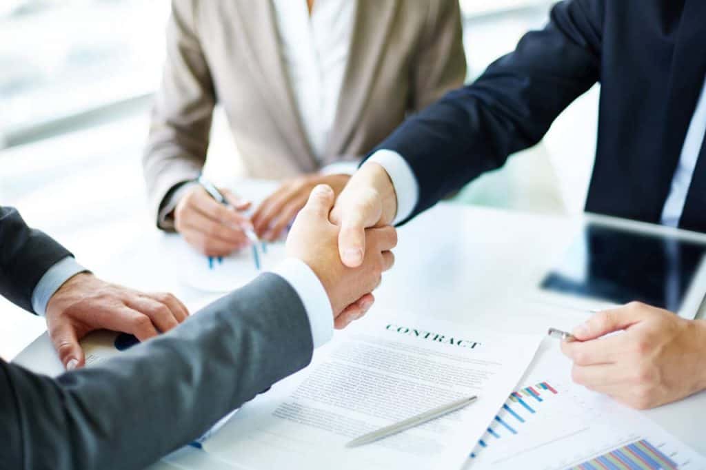 Businessman shaking hands after applying for a business loan