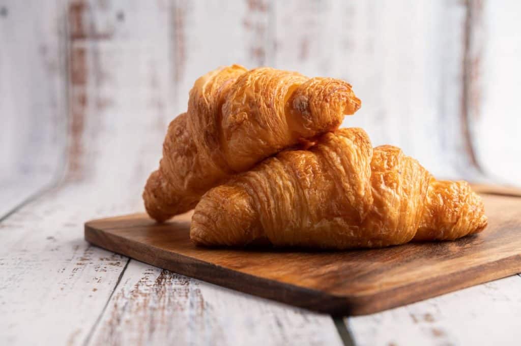 Croissants on a wooden cutting board
