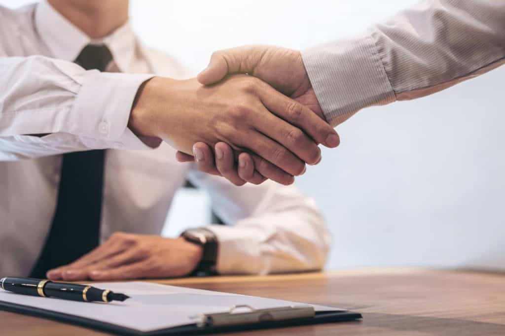 Businessman and customer shaking hands